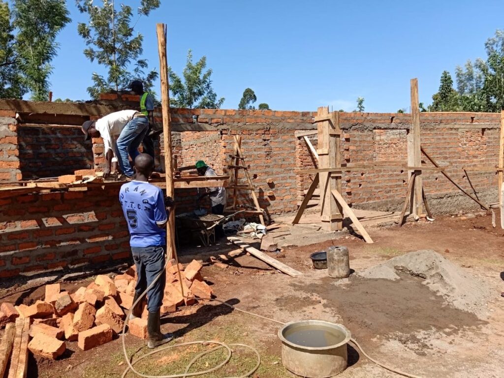 Workers continuing masonry work on the building