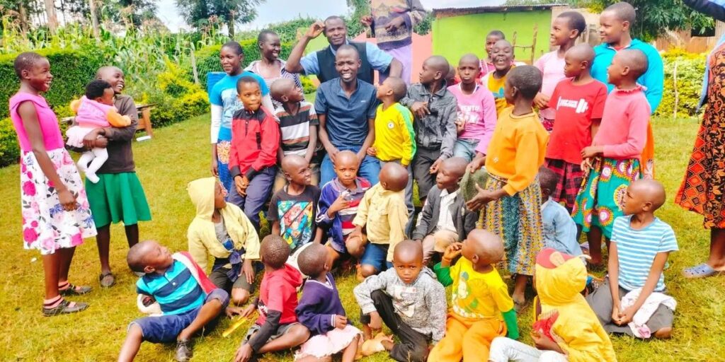 Children and caregivers gathered together at Lord Has Mercy Orphanage