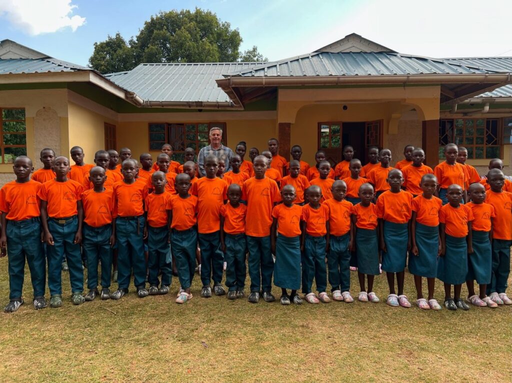 The children gathered for a group portrait in front of their home